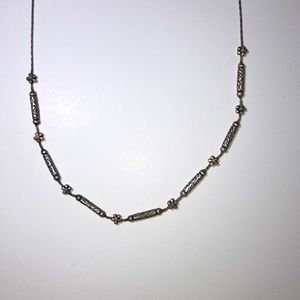 Silver chain and bead necklace.
